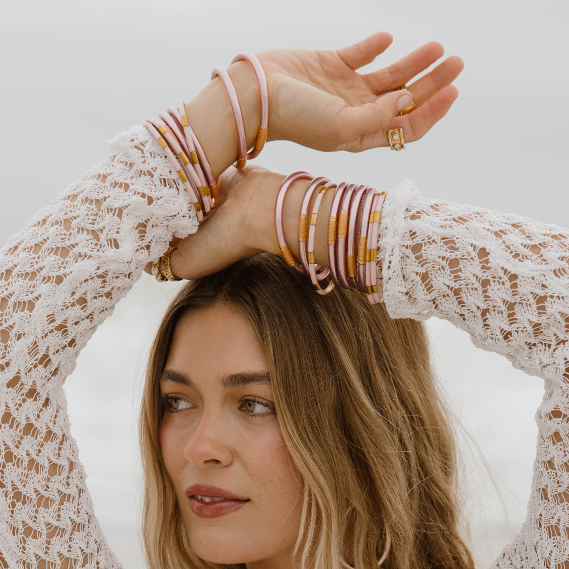 a woman with her hands on her head